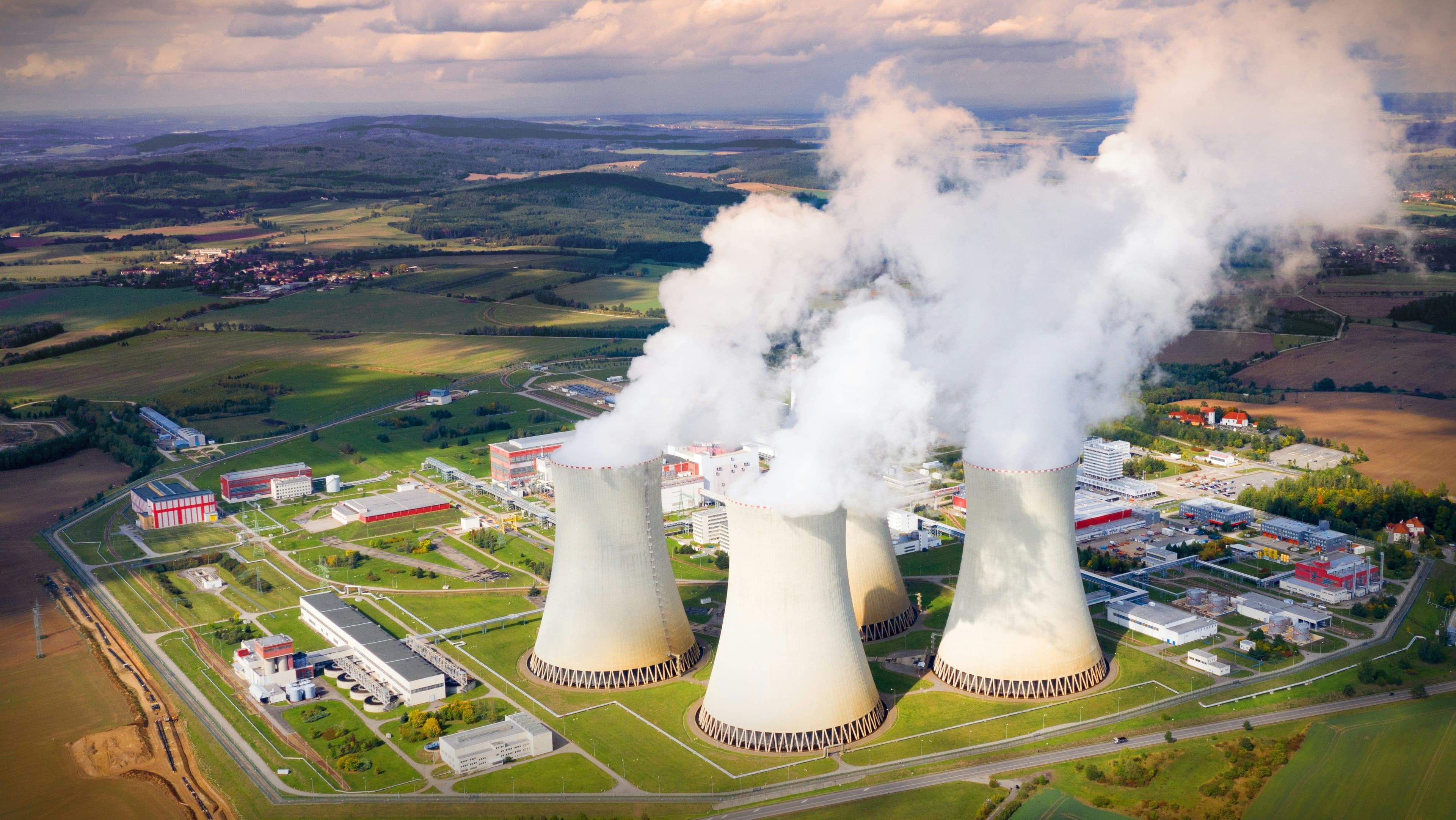 Conceptual image of xU3O8 tokenized uranium tokens on Etherlink blockchain with nuclear energy backdrop, illustrating Tezos-powered RWA tokenization